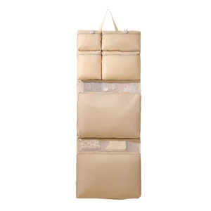 Beige hanging travel organizer bag with multiple zipper pockets and mesh compartments