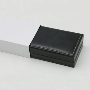 Rectangular black leather watch gift box with white stitching and outer sleeve cover