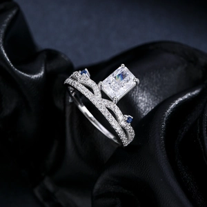 Sparkling S925 sterling silver crown ring with a large rectangular stone on black leather