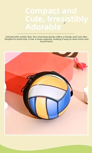 Close-up of a volleyball-shaped mini coin purse with a yellow, white, and blue zipper design
