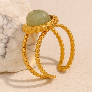 Detail of 18K gold-plated beaded double ring with translucent green aventurine stone