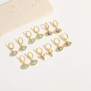 Exotic evil eye and bull head hoop earrings set with zircon stones in gold finish