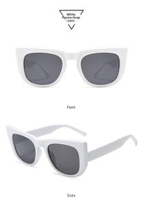 Detailed side and front view of oversized white cat-eye sunglasses with grey lenses