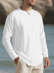 Detail of white cotton linen Henley shirt showing vertical pleats and standing collar