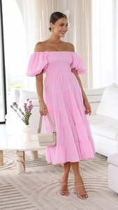 Detail of pink off-shoulder puff sleeve dress with tiered skirt and smocked bodice design