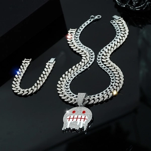 Silver iced out Cuban link chain necklace and bracelet set with ghost skull pendant