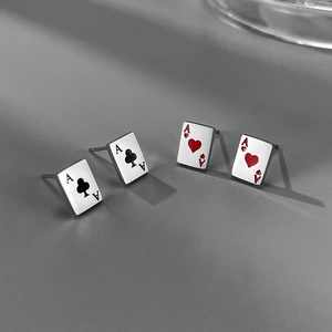 Detailed view of four Ace playing card stud earrings in heart and spade designs