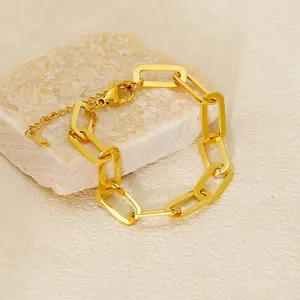 Elegant 18K gold plated stainless steel paperclip chain bracelet on marble stone