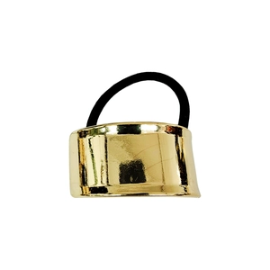 Detail of golden semi-circular metal buckle on black high-elasticity hair tie band