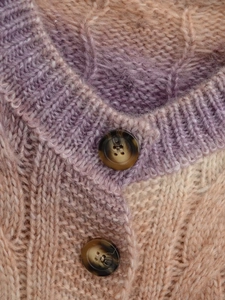 Close-up of lavender rib-knit collar with premium marble buttons on chunky soft cardigan