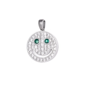 Close-up of a silver smiley face pendant with sparkling zircons and green gem eyes
