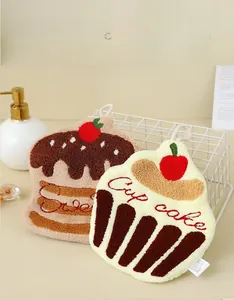 Detail view of thickened three-layer coral fleece towels in cute cupcake shapes