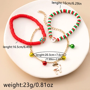 Detailed view of Christmas themed charms featuring colorful bells, reindeer and clay beads