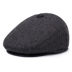 Men's dark gray wool blend flat cap with ear flaps for winter warmth and retro style