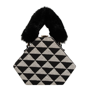 Fashionable black and white geometric triangle handbag with plush faux fur handle
