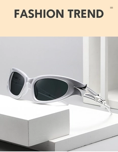 Detailed close-up of silver cyberpunk sunglasses featuring iconic metal star ornaments