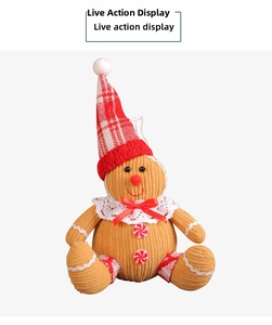 Close-up of gingerbread man plush pendant with corduroy texture and red plaid hat