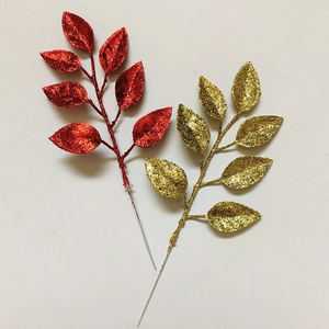 Macro detail of artificial glitter leaves for Christmas DIY crafts and wreath decoration