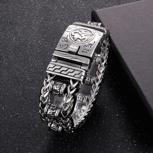 Detailed view of silver punk dragon bone chain bracelet with engraved vintage symbols
