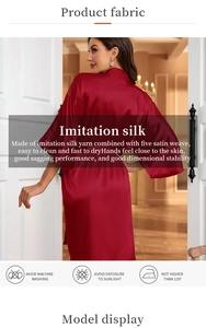 Detail of deep red imitation silk robe showing smooth five satin weave fabric texture