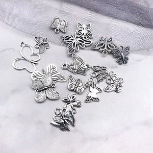 Detailed view of assorted Tibetan silver butterfly alloy charms for DIY jewelry making
