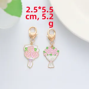 Detail of pink floral enamel charms with lobster clasp for bags and keyrings