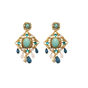 Vintage gold drop earrings with turquoise stones and navy teardrop beads on white back