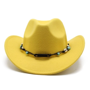 Detail of yellow wool felt cowboy hat with shell and bead decorative band
