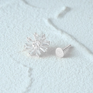 Macro shot of S925 sterling silver flower stud earring with cubic zirconia and flat back