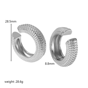 Detailed view of silver snake skin textured earrings measuring 28.5mm by 8.8mm in size