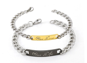 Detail of Cuban link couple bracelets with engraved One Love and One Life charms