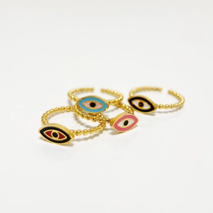Detail of four colorful enamel evil eye open rings with gold beaded bands in various colors
