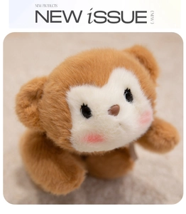Close-up of soft plush bear head featuring brown fur and white facial detail