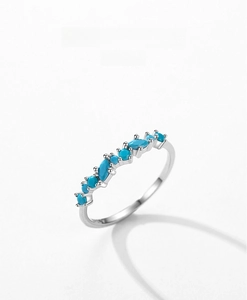 Detail of S925 silver ring with turquoise stones in marquise and round shapes