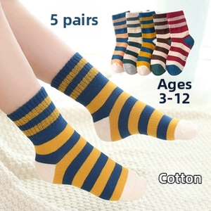 Detail of 5-pack cotton striped socks for kids aged 3-12 on a cozy white knit blanket