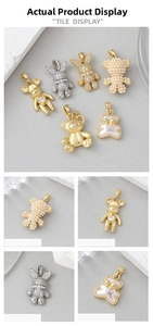 Detail view of 14K gold plated bear and bunny pendants with pearls and cubic zirconia