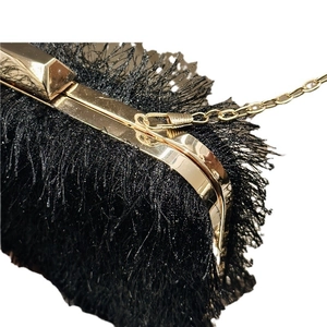 Elegant black feather evening clutch bag with gold metal frame and chain strap