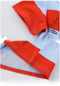 Detail of sleeve stitching and hem line on striped cotton t-shirt with excavator print