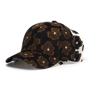 Detail of floral pattern baseball caps in black and white options for outdoor sun protection