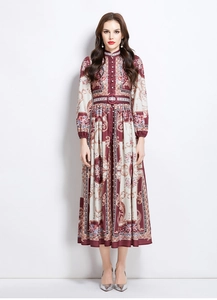 Detail showing vintage royal pattern on high collar dress with elegant waist belt