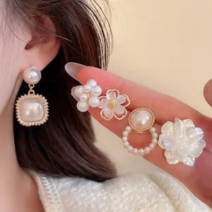 Elegant floral pearl earring set with rhinestone accents in vintage aesthetic