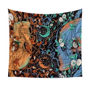 Skull tapestry featuring celestial sun moon and vine motifs in orange and blue tones