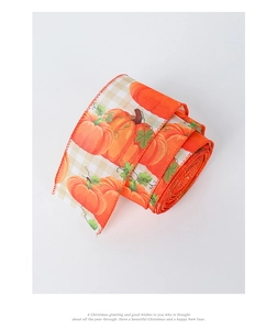 Detailed view of orange harvest ribbon featuring realistic pumpkin prints and plaid edges