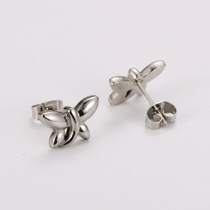 Minimalist silver dragonfly stud earrings in polished stainless steel for women