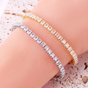 Elegant gold and silver V-shaped tennis bracelets with square-cut cubic zirconia crystals