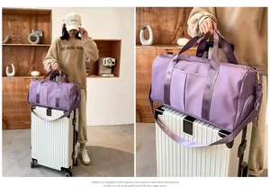 Detail of purple yoga fitness bag showing waterproof fabric and trolley sleeve function