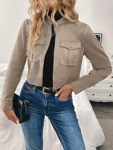 Detail of khaki faux suede jacket featuring utility chest pockets and gold button accent