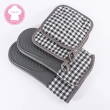 Gray silicone oven mitt and pot holder set with classic black and white checkered fabric