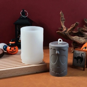 Detail of a silicone mold showing a textured Halloween pumpkin ghost face candle design