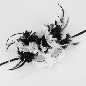 Detail view of Day of the Dead mask with feathers, lace flowers and hand-painted crackle texture